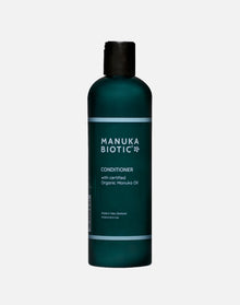  Manuka Biotic conditioner in a teal green tall bottle