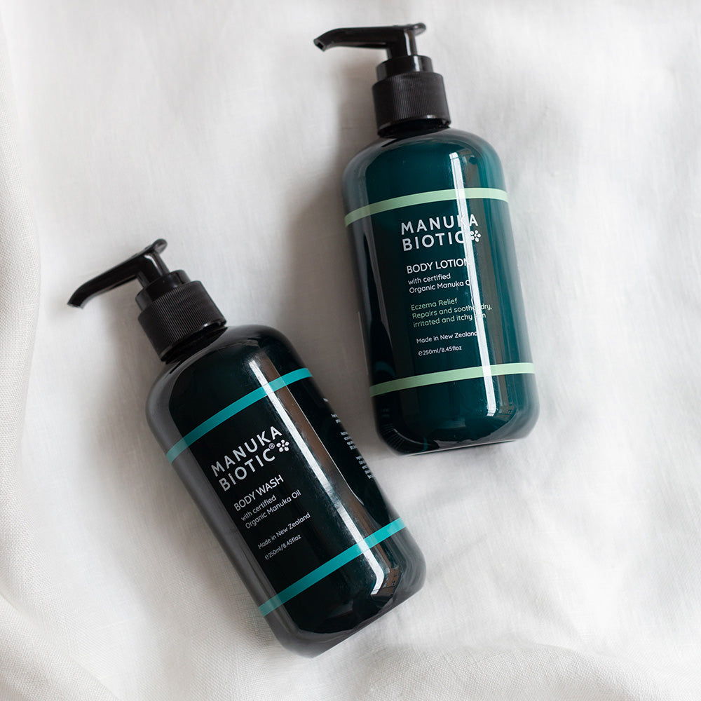  Two Manuka Biotic pump bottles containing body wash and body lotion