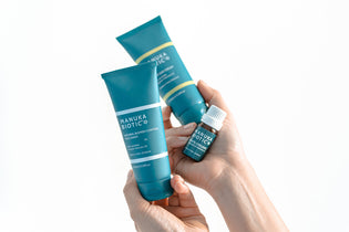  Lady holding in her hands the Acne Bundle from Manuka Biotic  to use on a teenagers acne. 