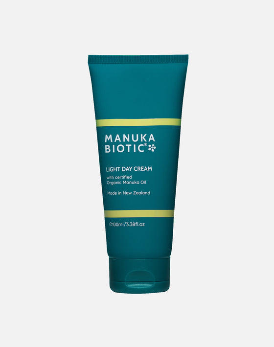 Manuka Biotic light day cream in a teal green upright tube