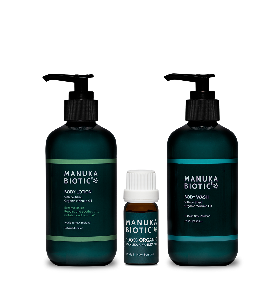  Manuka Biotic products in teal green pump bottles containing body lotion and body wash and a small glass bottle of organic mānuka oil