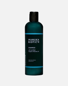  Manuka Biotic shampoo in a teal green tall bottle