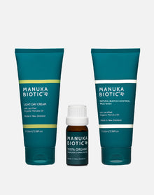  Manuka Biotic products in teal green upright tube bottles includes light day cream and face wash and a small glass bottle of organic mānuka oil